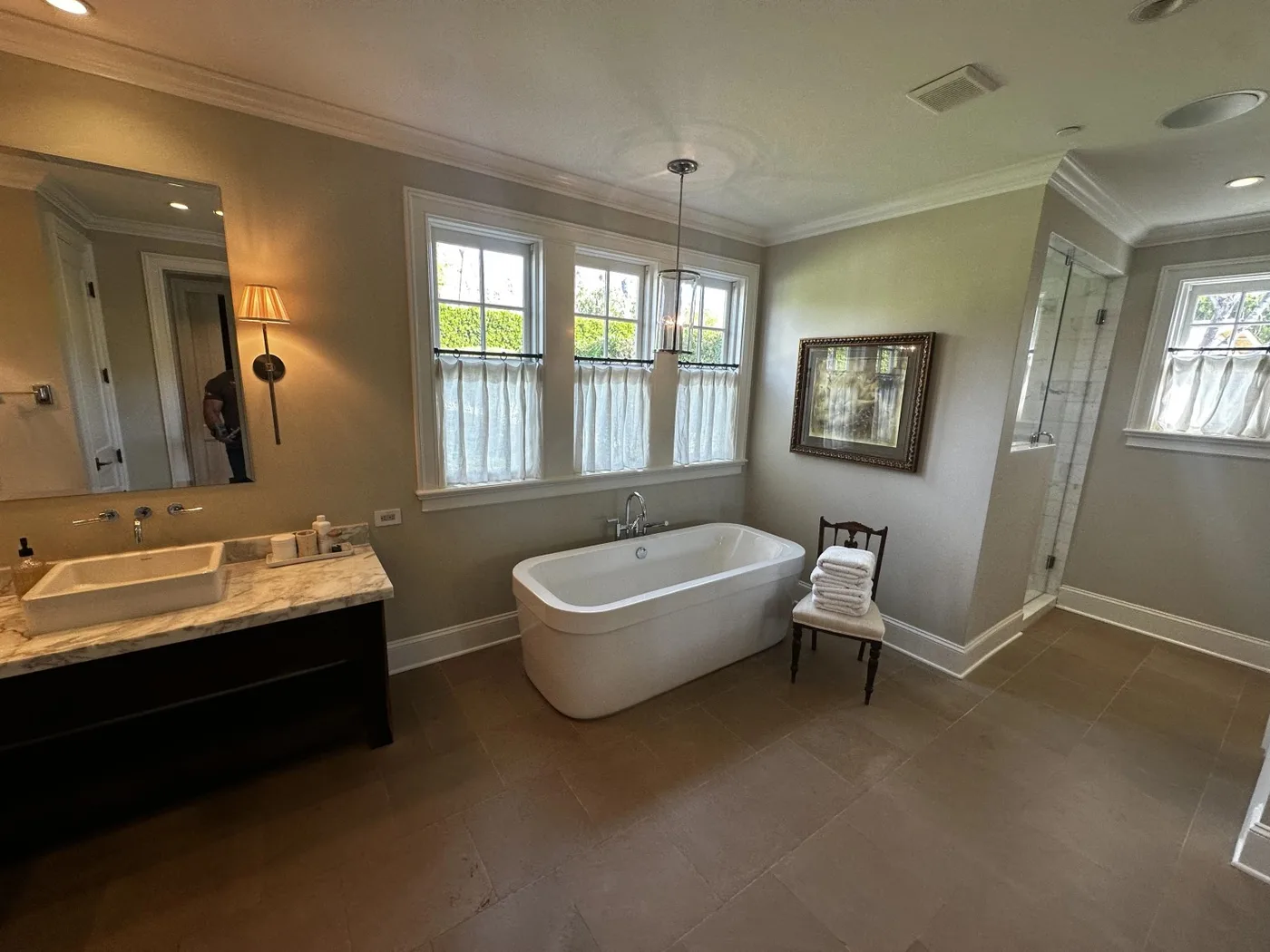 Luxury bathroom tile flooring and custom shower area in a high-end residential space