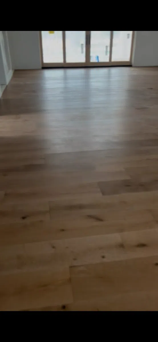 Wide plank flooring installed through a residential interior